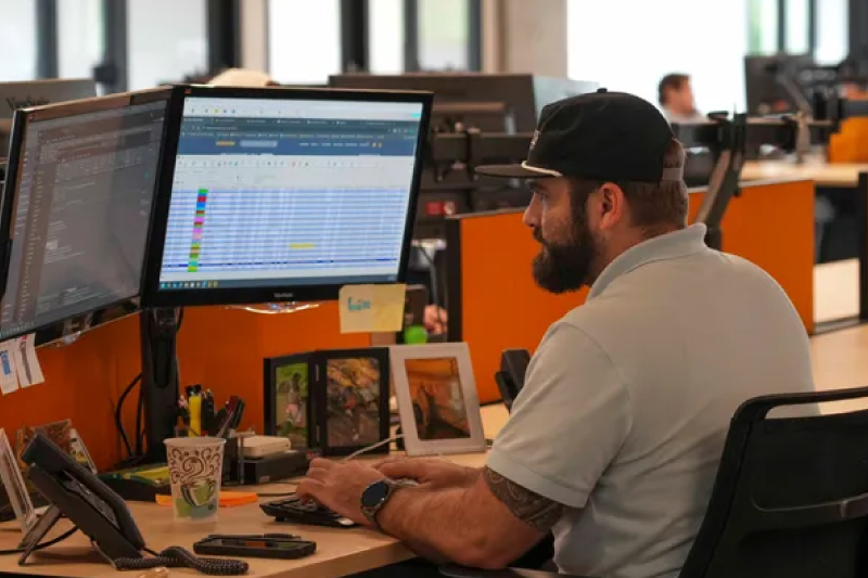 A safety manager reviewing a driver qualification record