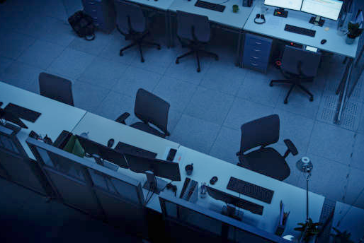 A recruiting office after hours, screens still on